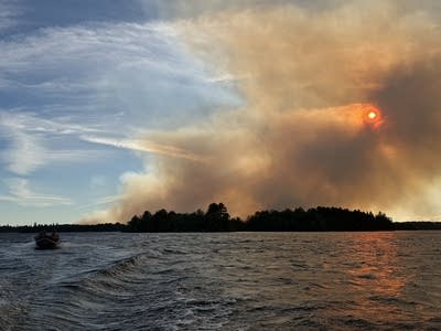 The sun and smoke over water