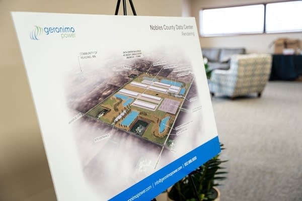 A mockup plan for a data center is seen on a poster board on an easel.