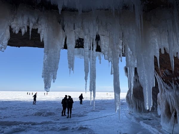 Hikers explore the Apostle Islands ice caves