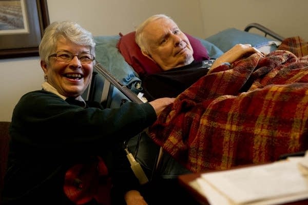 Elaine and Hank Scherdin listen to the harp