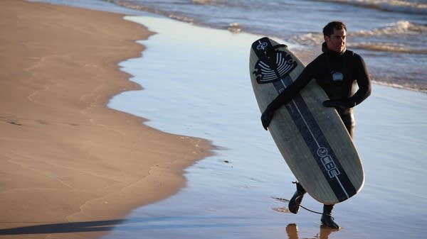 A growing number of surfers are braving the Great Lakes' cold waters to catch some wintertime waves. 