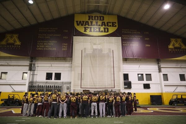 University of Minnesota players speak to reporters.