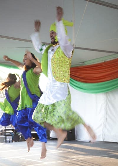 Dancers leap joyfully to music