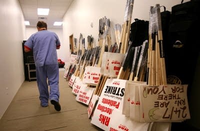 Strike signs wait in MNA hallways