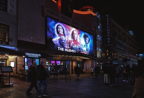 Vue West End - Leicester Square, Central London, London's West End in England, United Kingdom, Great Britain – 05th November 2023: A street view at night time in Central London, UK. Marvel Comics - The Marvels film (Distributed by: Walt Disney Studios Motion Pictures - American superhero film) movie poster. Captured at the Vue Cinemas.