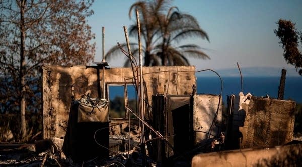 The ruins of an ocean view home are seen in the aftermath of the Woolsey Fire in Malibu, California.