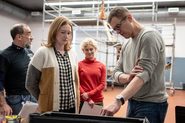 A person discusses production details