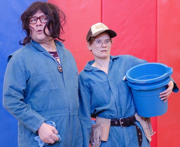 Luverne Seifert and Kimberly Richardson play car wash attendants