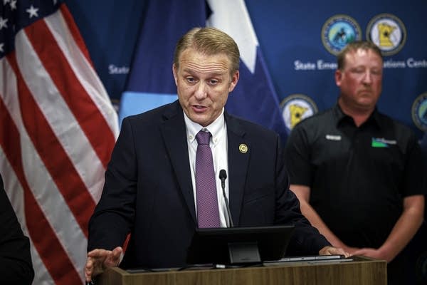 A man talks at a press conference