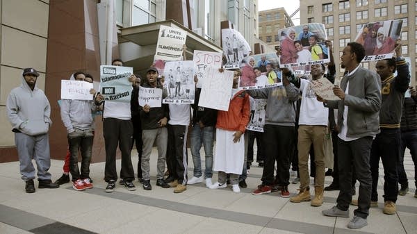 Young men show their support for those who were sentenced.