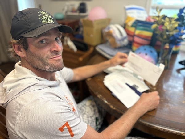 Man posing with mail