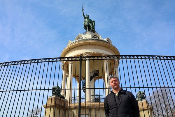 man standing by Hermann the German Monument 