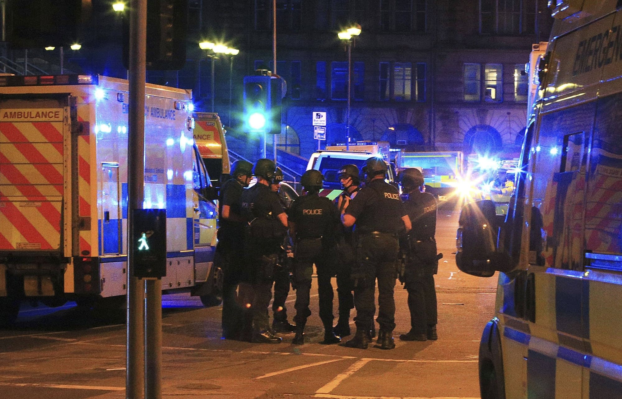 Armed police gather at Manchester Arena