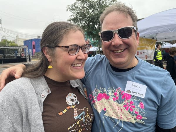 Two people pose for a photo.