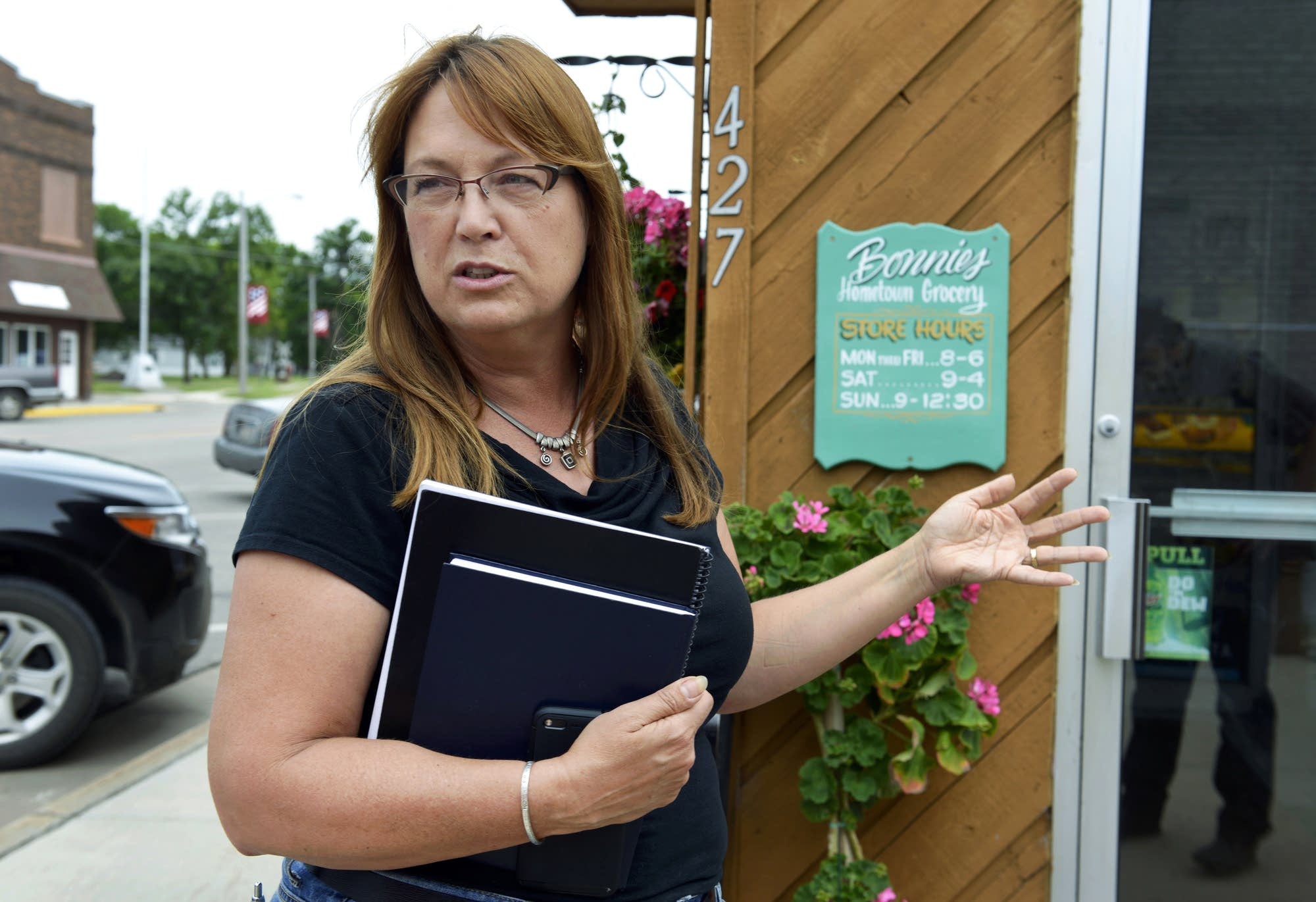 Kathryn Draeger in front of Bonnie's Hometown Grocery