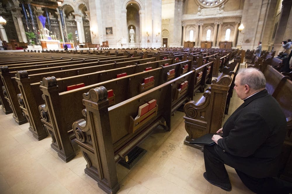 Archbishop Bernard Hebda takes a moment of prayer.