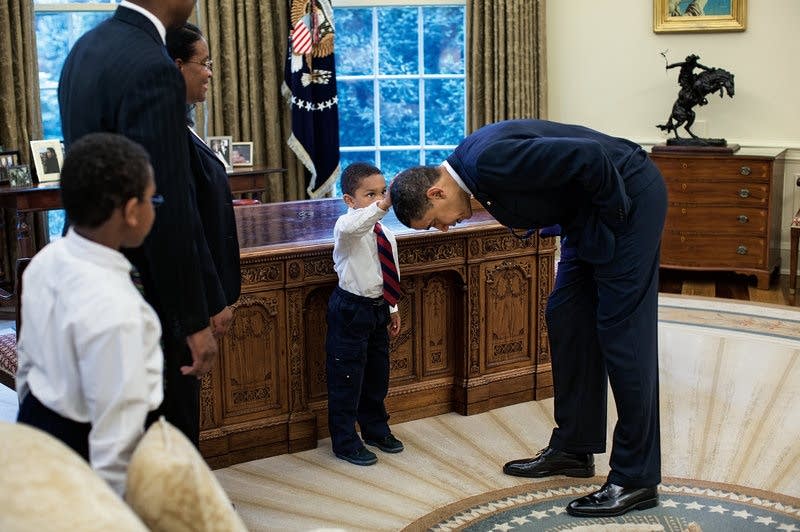Obama let a staffer's son feel his hair.