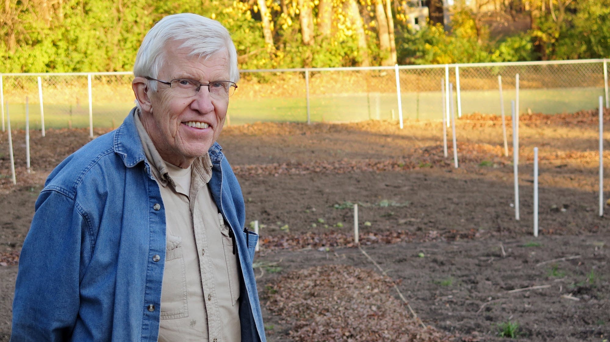 Tom Staffa stands in front of his now-empty garden.