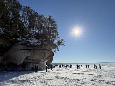 Hikers explore the Apostle Islands ice caves