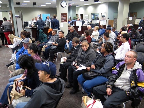 People waited in the lobby of the state Driver and Vehicle Services.