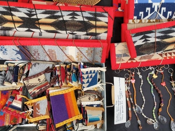 Colorful bags, wraps and jewelry displayed on a table