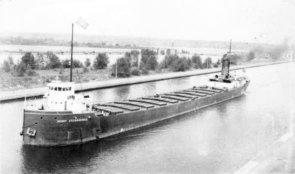 A black and white photo of a Great Lakes freighter