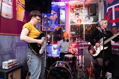 Band performing by window
