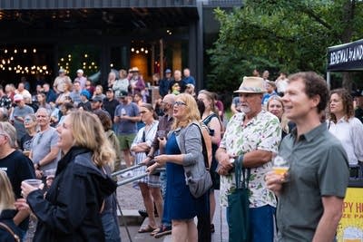 people enjoying the currents happy hour at surly brewing