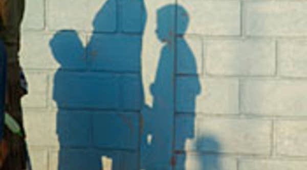 Shadows of mother with children.