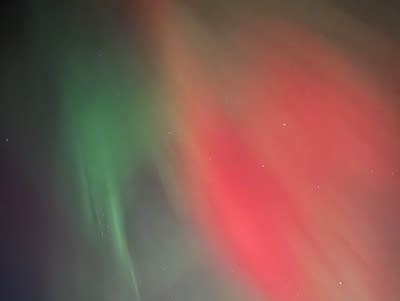 Red and green lights cover the night sky.