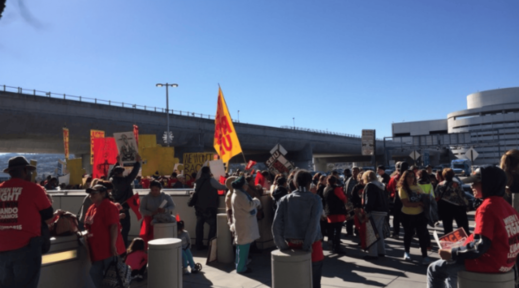 Workers from around Northern California demonstrate outside San Francisco International Airport on Tuesday to demand higher wages.
