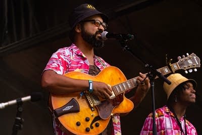laamar and his band performing on stage