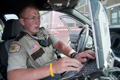 Deputy Sheriff Jeff Nelson writes a ticket