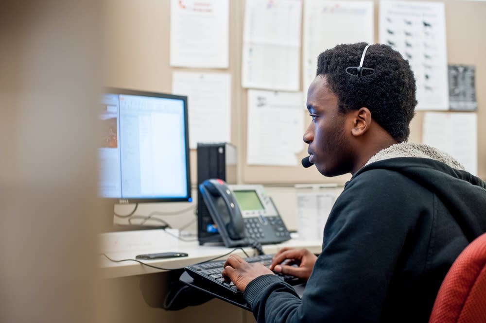 Lamin Ceesay working at his job in Minneapolis.