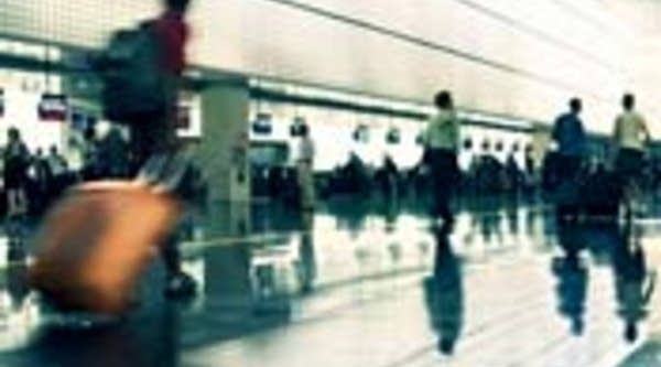 Travelers try to beat the rush at the airport