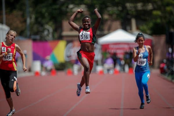 A runner celebrates on winning a race