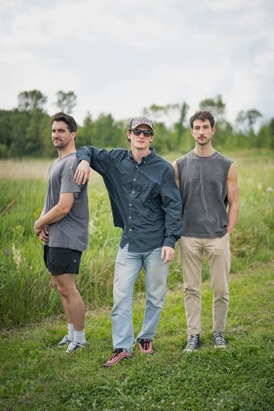 3 members of yam haus posing for an outdoor photo
