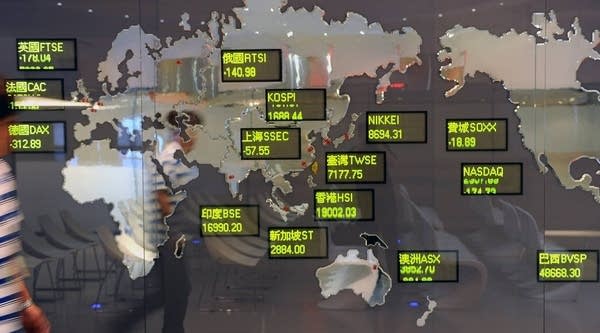 A billboard showing global stock indices at the Taiwan Stocks Exchange in Taipei.