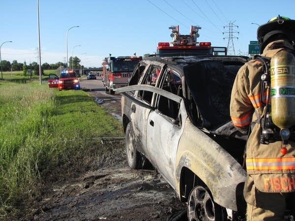 Wow: Guy rips open door, pulls driver from burning car