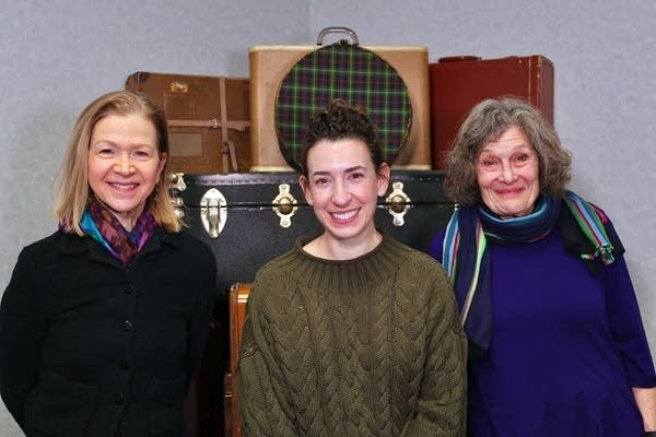 three people smiling