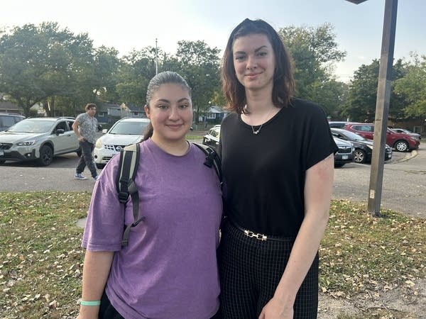 two women outside posing for photo