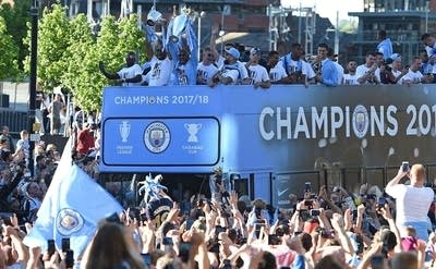 Manchester City celebrate winning the 2017-2018 Premier League