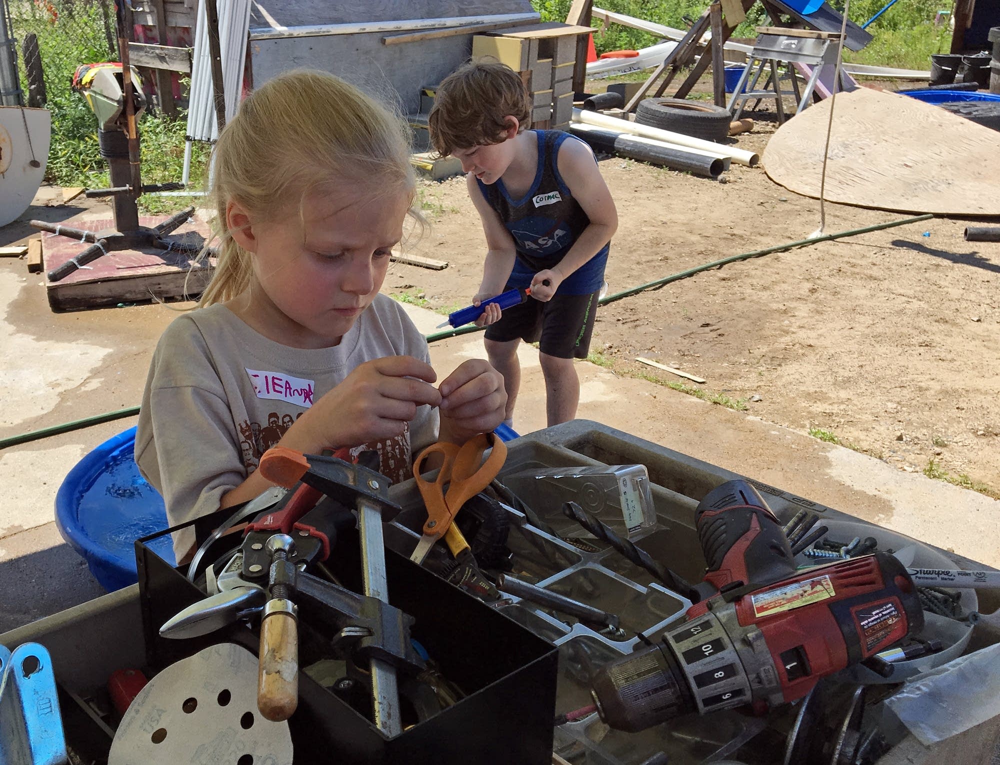 Eleanor Riebe, 6, looks for the right nail for her project.
