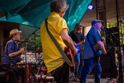 a band performing on an outdoor stage