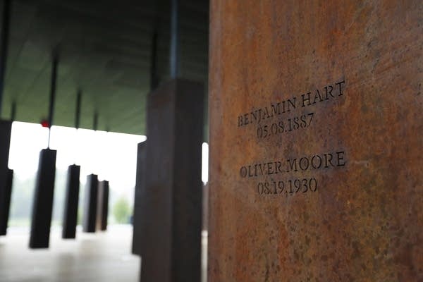 Names of lynching victims are carved in metal at the National Memorial.