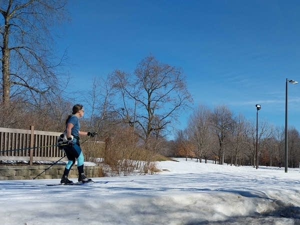 A cross-country skier traverses man-made snow