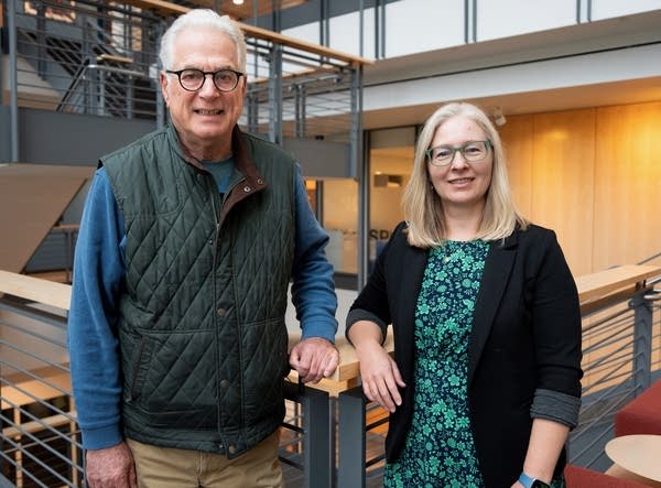 a man and a woman posing for a portrait