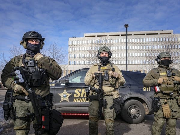 Hennepin County sheriff’s deputies stand