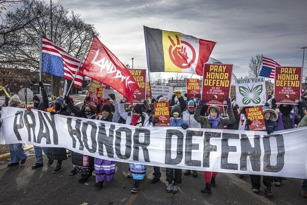 Indigenous and faith leaders marching