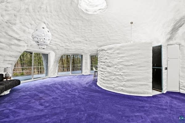 A white "Flintstone" shaped house for sale in Duluth.
